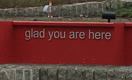 red welcome sign